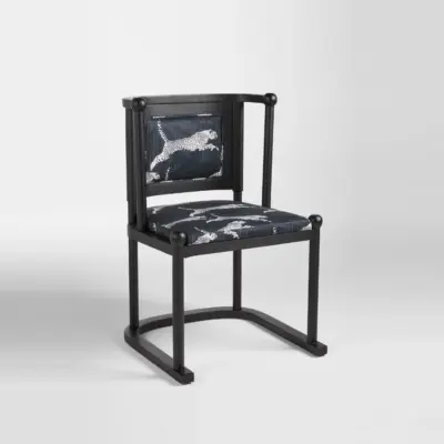 Avant-Garde Black Oak Dining Chair with Bold Leopard Print Upholstery