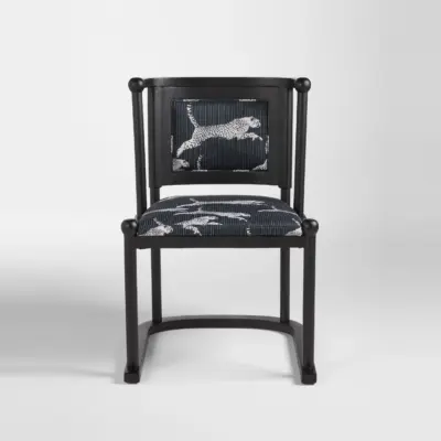Avant-Garde Black Oak Dining Chair with Bold Leopard Print Upholstery